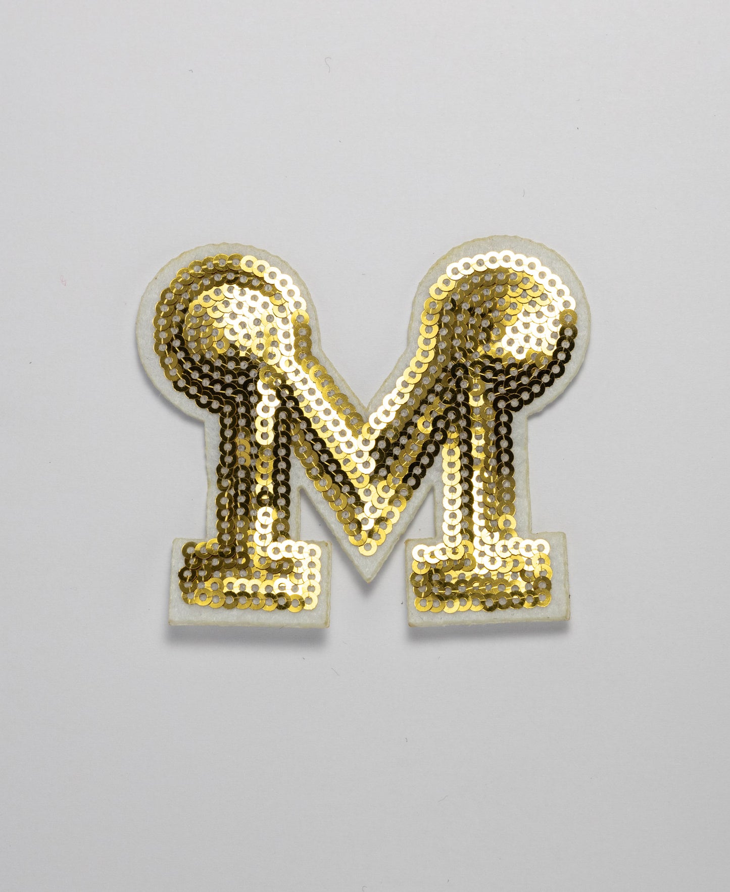 Iron on Motif - Gold Sequence "M"