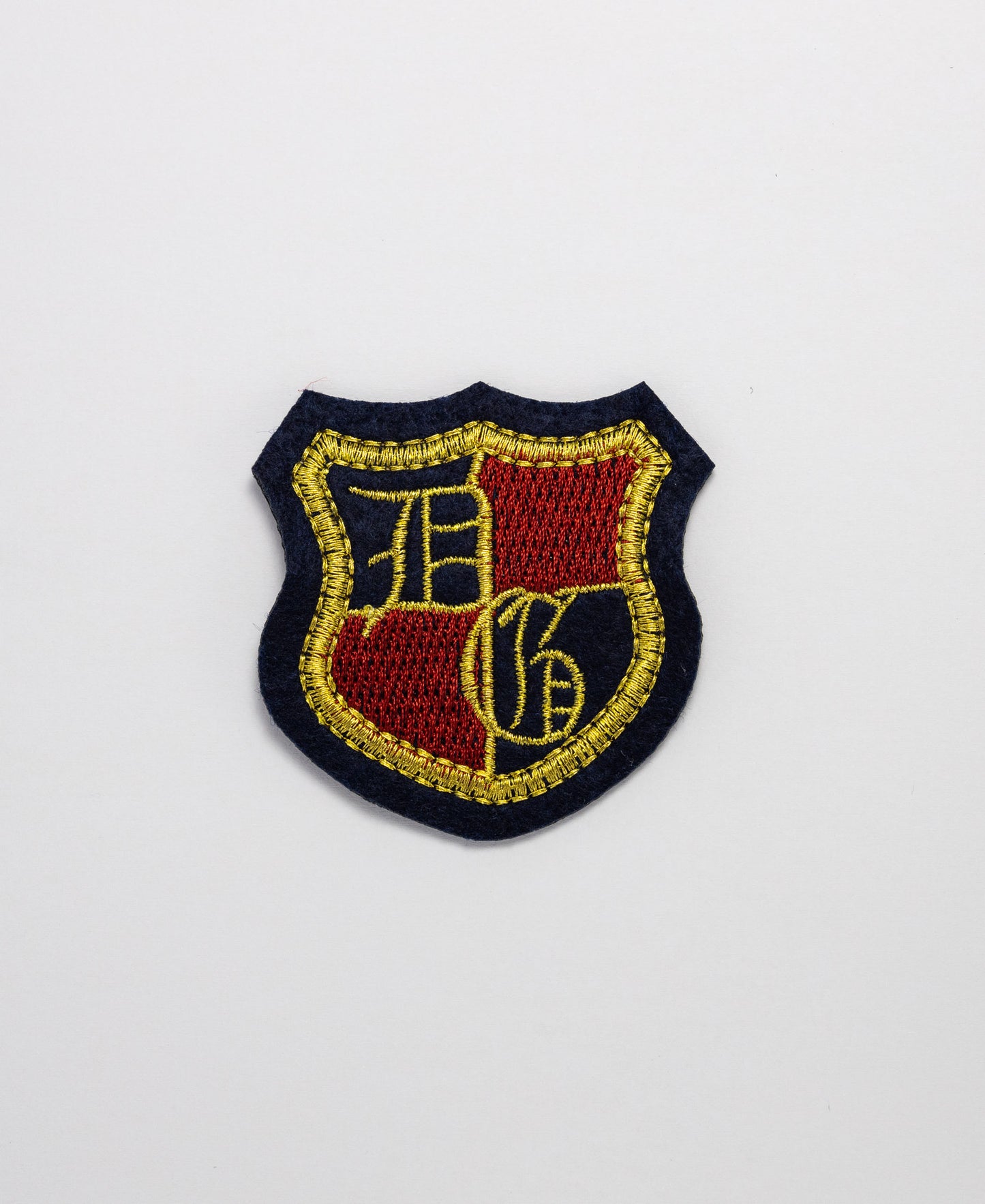 Iron on Motif - Navy/Gold/Red Badge